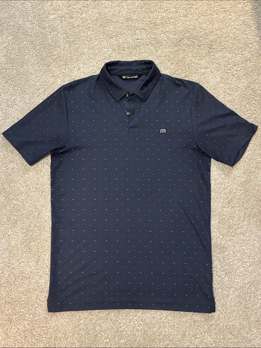 TravisMathew Navy Polo with Micro Dot Pattern